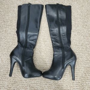 Under the knee black heeled platform boot. Size 4M